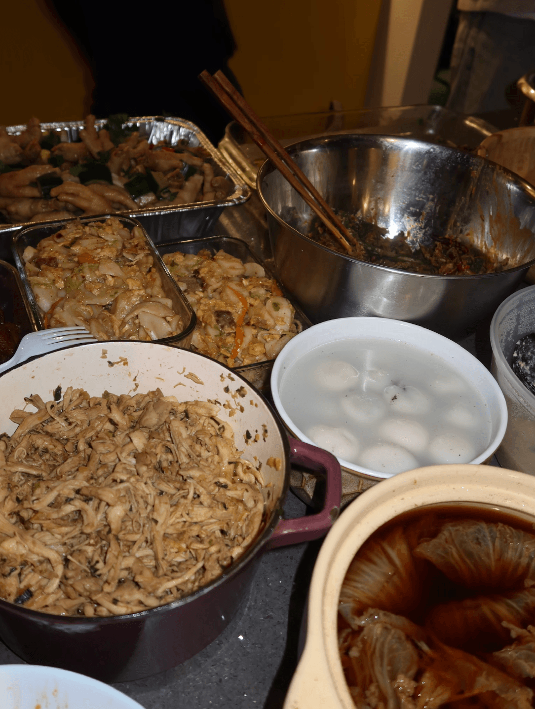 A picture of a variety of cooked food on a wide table