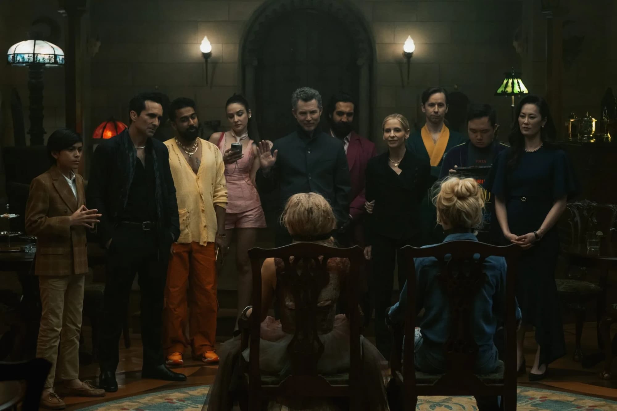 A screencapture from 'Ready or Not 2: Here I Come' of the a group of antagonists staring down at the two protagonists